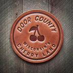 Door County Wisconsin's Cherry Land Leather Coaster