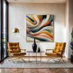 Modern living room with two yellow chairs, a round table, and a colorful abstract painting on the wall.