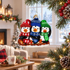 Penguin Trio Sledding Glass Christmas Ornament