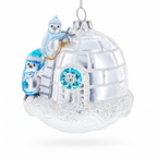 Penguins Decorating Igloo Glass Christmas Ornament