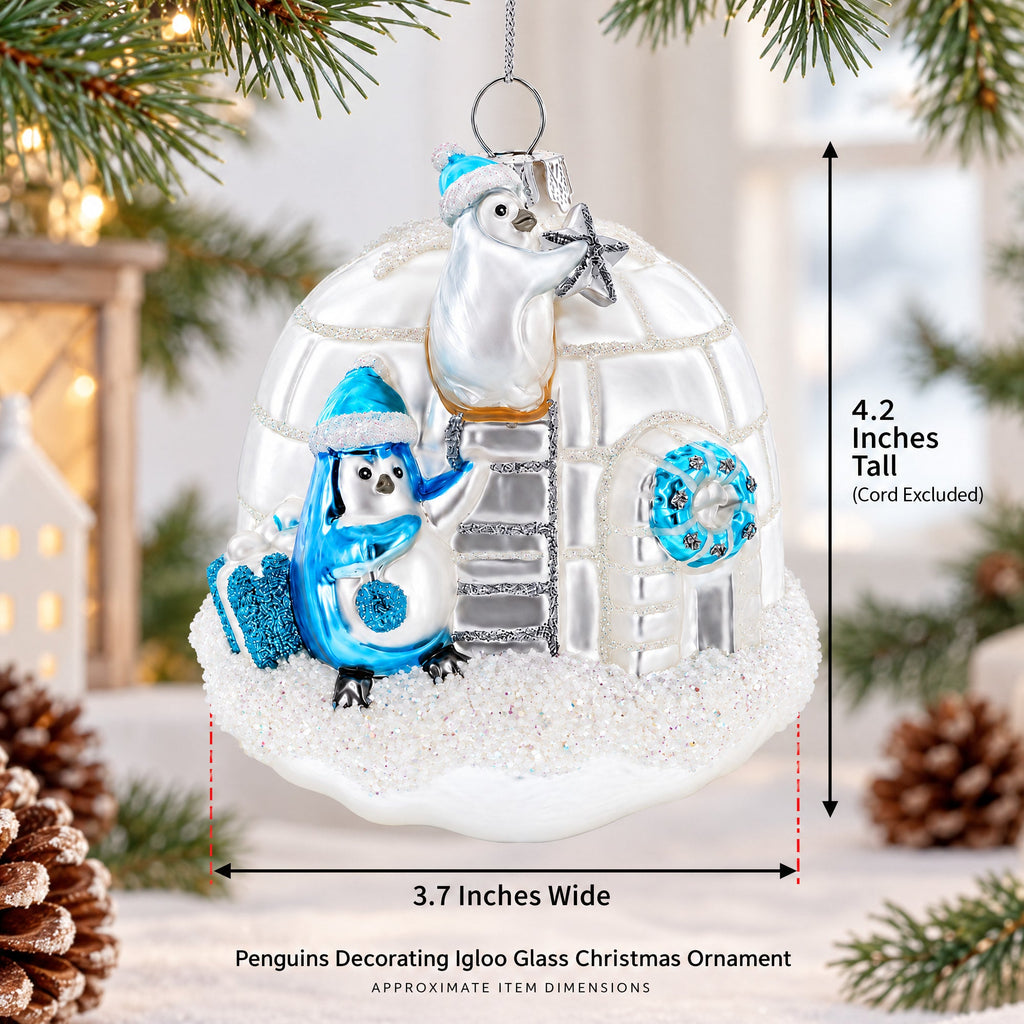 Penguins Decorating Igloo Glass Christmas Ornament