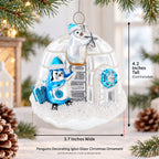Penguins Decorating Igloo Glass Christmas Ornament