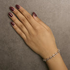 Diamond infinity and swirl link bracelet in 10k two tone gold 1/4 cttw bijoux-nyc direct