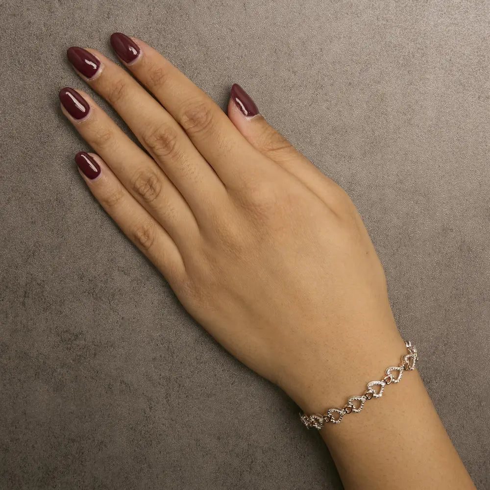 Diamond infinity and swirl link bracelet in 10k two tone gold 1/4 cttw bijoux-nyc direct