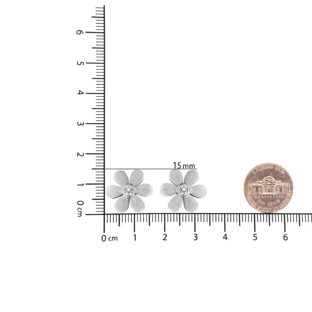 Diamond flower stud earrings in matte sterling silver 1/20 cttw bijoux-nyc direct